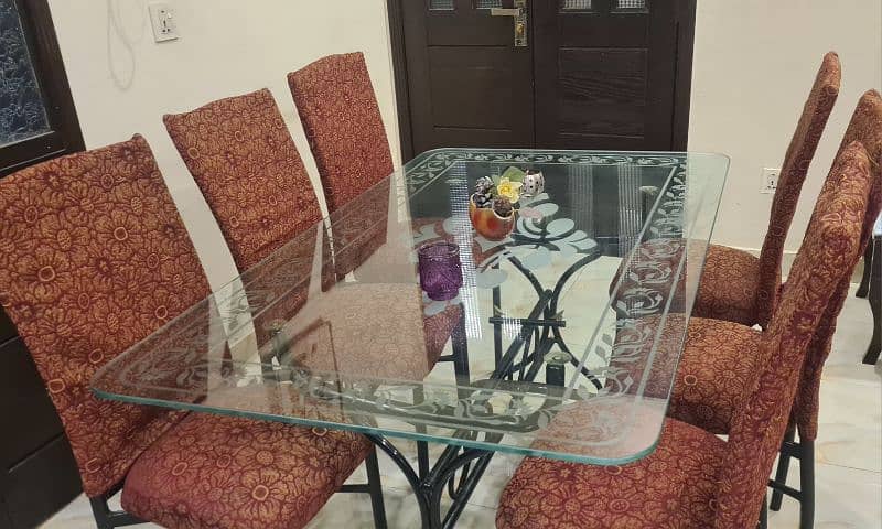 Glass dining table with six chairs for sale 0