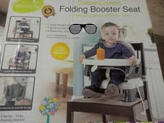 Folding booster seat