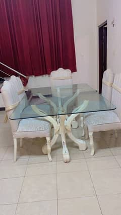 stuning 6 seater wooden dining table with glass top for sale