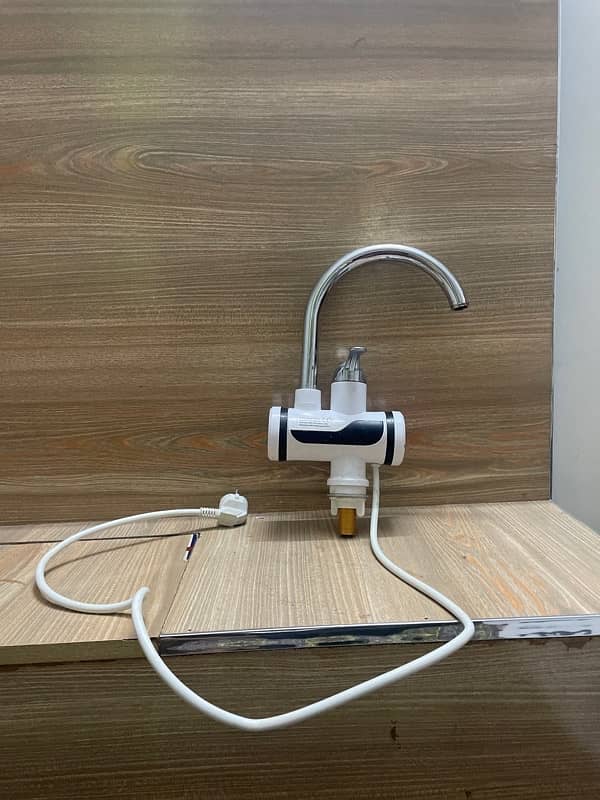 Instant electric heating water tap. 2