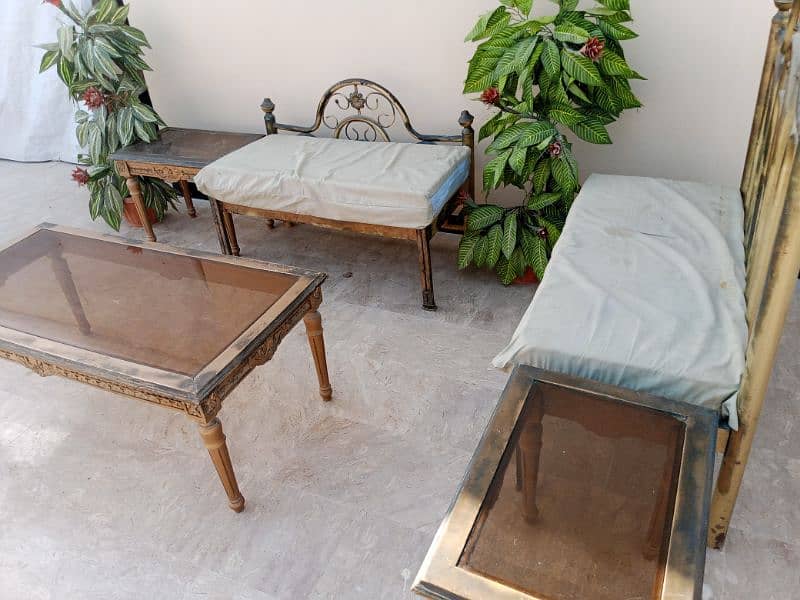 iron sofa set with tables and plants 2