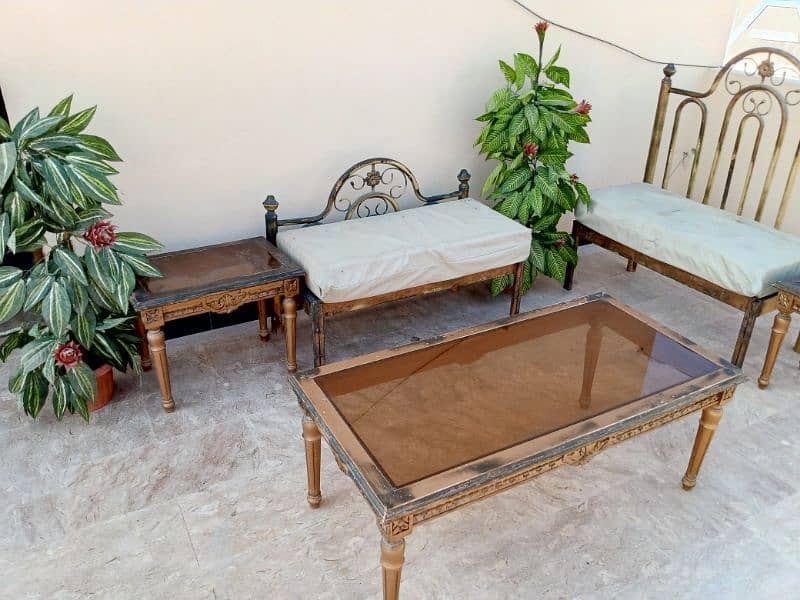 iron sofa set with tables and plants 3