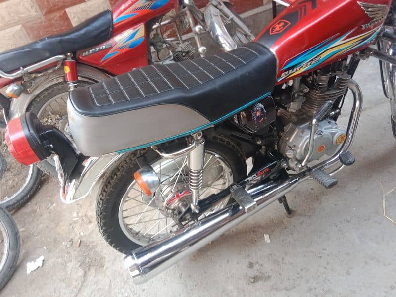 Honda 125 golden number Akk 202 with golden serial number 786 9