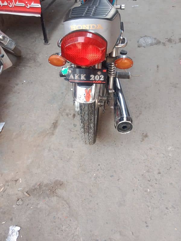 Honda 125 golden number Akk 202 with golden serial number 786 10