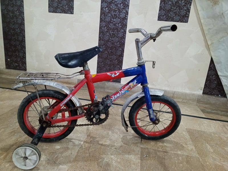 child cycle with spiderman sticker. 1