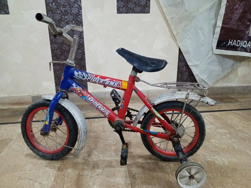 child cycle with spiderman sticker. 2