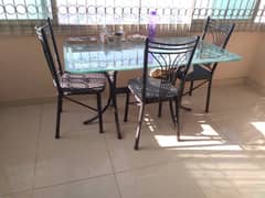 Urgent sale  6 seater Glass Dining Table with 3 chairs, good condition