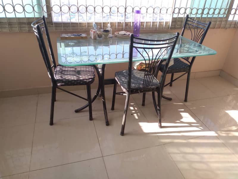 Urgent sale  6 seater Glass Dining Table with 3 chairs, good condition 0