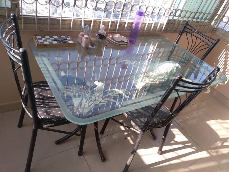 Urgent sale  6 seater Glass Dining Table with 3 chairs, good condition 1