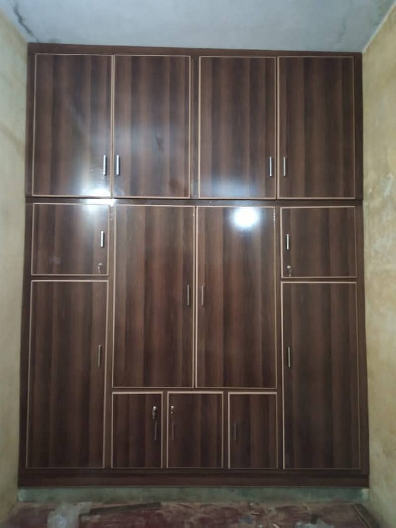 wooden doors,kitchen wooden works,wardrobes,media wall,wooden cabinet 5