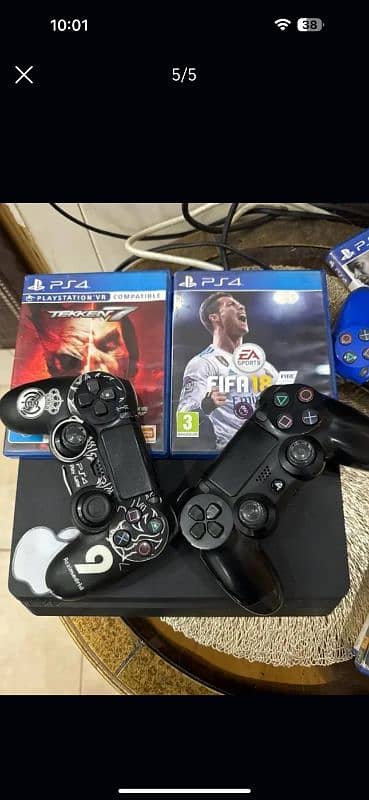 PS4 slim 1tb/ Scratchless / With 2 controllers and 2 cds . 0