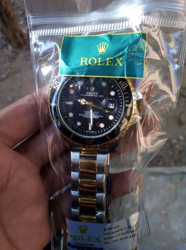 Rolex watch with golden steel strap 2