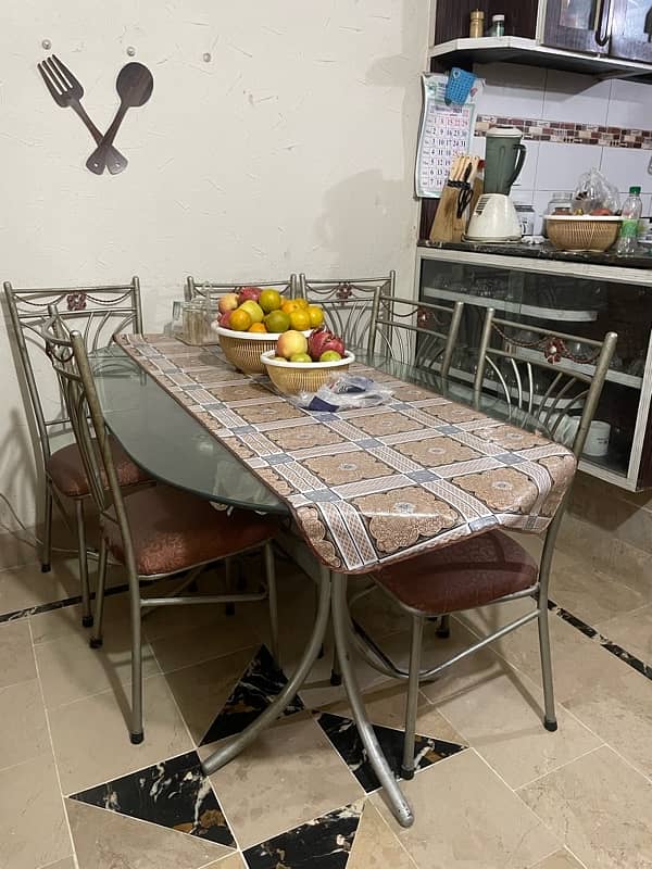 iron dinning table ,  glass top , with 6 chairs. 2