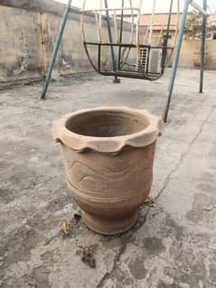 two medium sized pots with a small pot