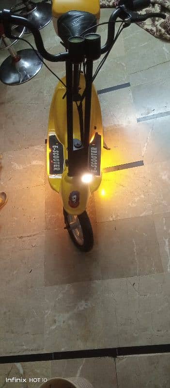 Kids electric scooty 8