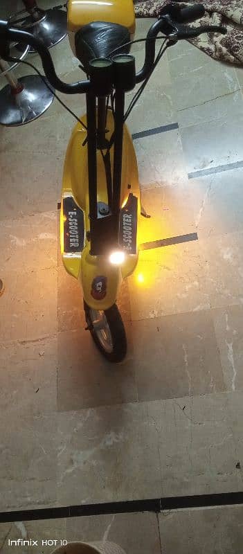 Kids electric scooty 11