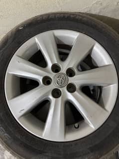 toyota corola altis 1.6 orignal  rims sacratchless with 2 new tyers