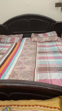 Double bed , Dressing , 2 side tables and show case .