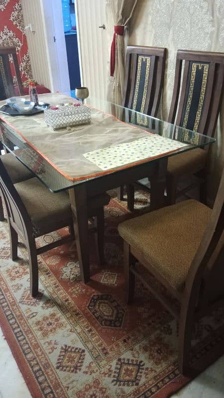 Almost new dining table with 6 chairs 0