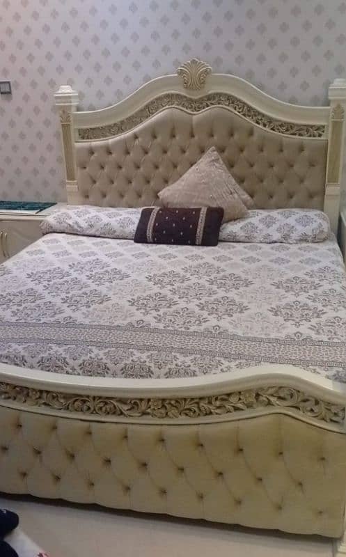 bed with side tables and dressing 0