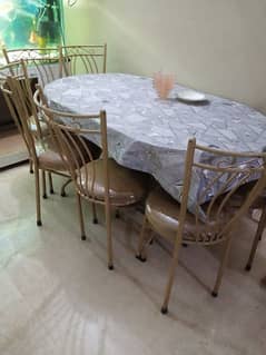 iron dining table with 6 chairs.