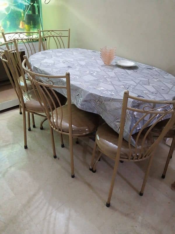 iron dining table with 6 chairs. 0