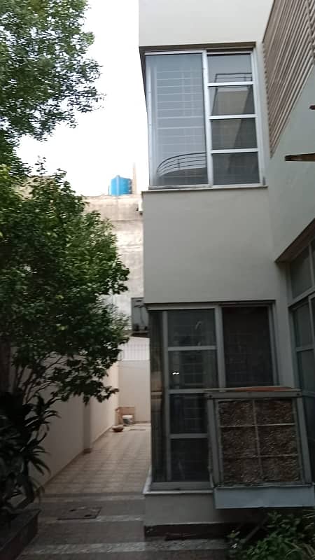 24 Marla Almost New Tile Flooring House Double Storey 5 Bed Attach Bath Double T. V Lounge Best For Two Brothers Resident It's Located To PIA Society D Block 21