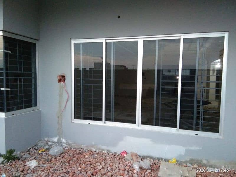 ALUMINIUM WINDOWS AND GLASS PARTITION 2