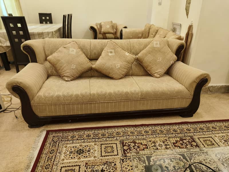 7 seater sofas. 2 pairs each 50,000. . Dining table 45,000 4