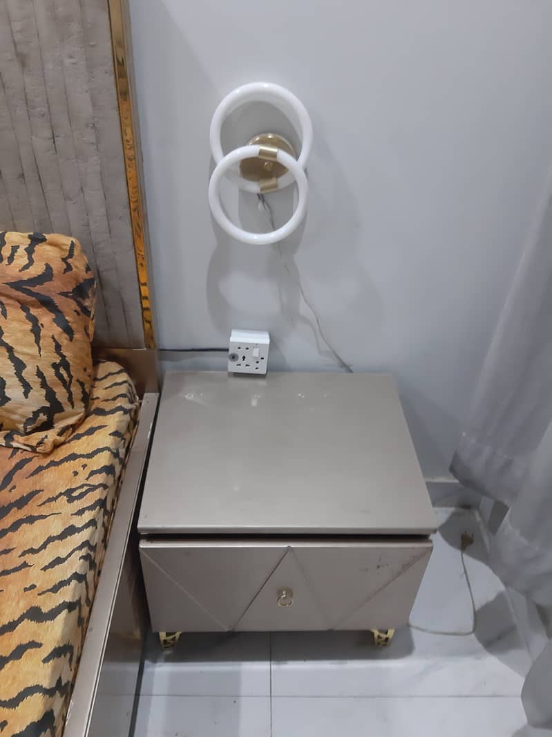 King-size bed 2 side tables, mattress, and dressing table for sale. 0