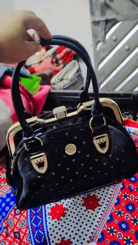 A Black hand bag for sell. 1