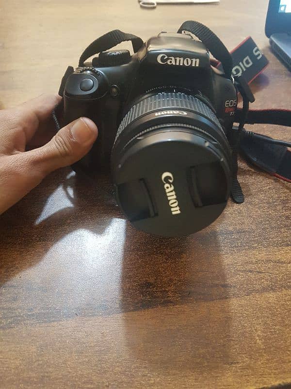 Canon  Eos rebal t3 model 18-55mm 5