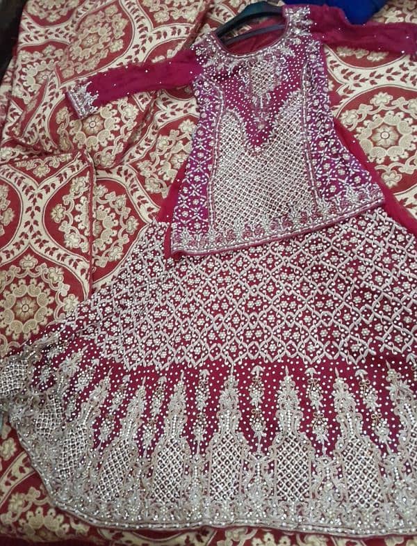 Good condition with  Beautiful Bridal dress۔fabric Pure Radish maroon۔ 1