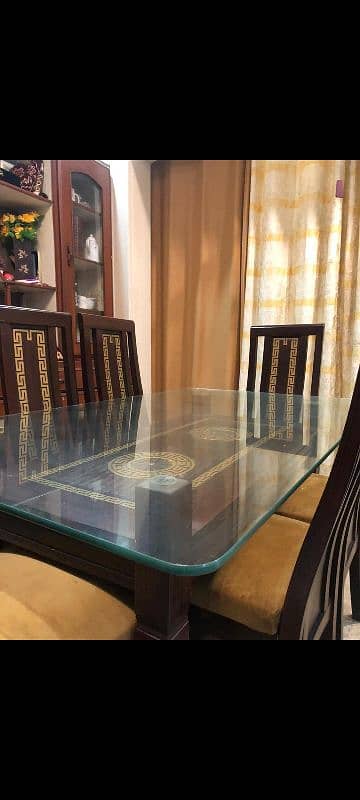 Wooden dining table with glass top 1