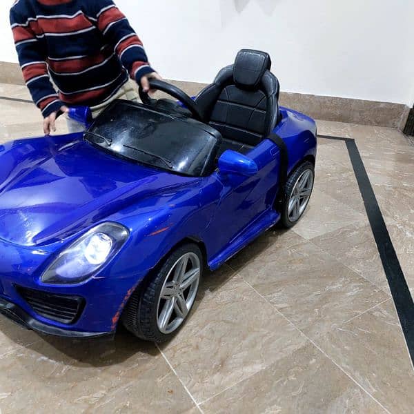 baby - kids car , remote controlled, new battery, new adaptor. 1