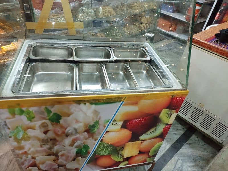 russian salad bar with utensils 0