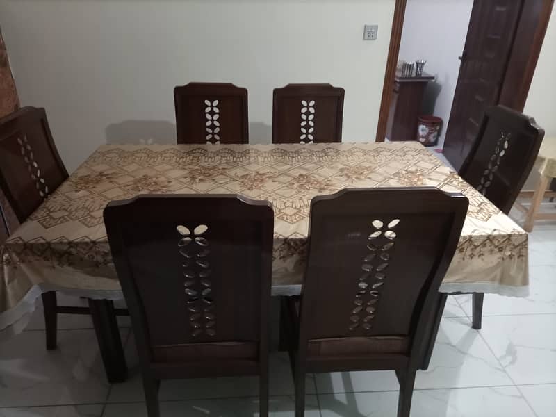 6 chairs dining table 2 in 1 (glass and wood) 1