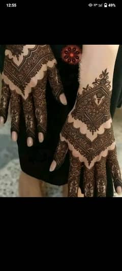 female mehndi expert and hairs expert also make-up.