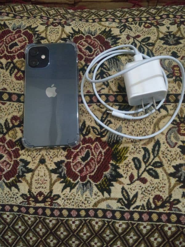 i-phone 12 mini with charger 3