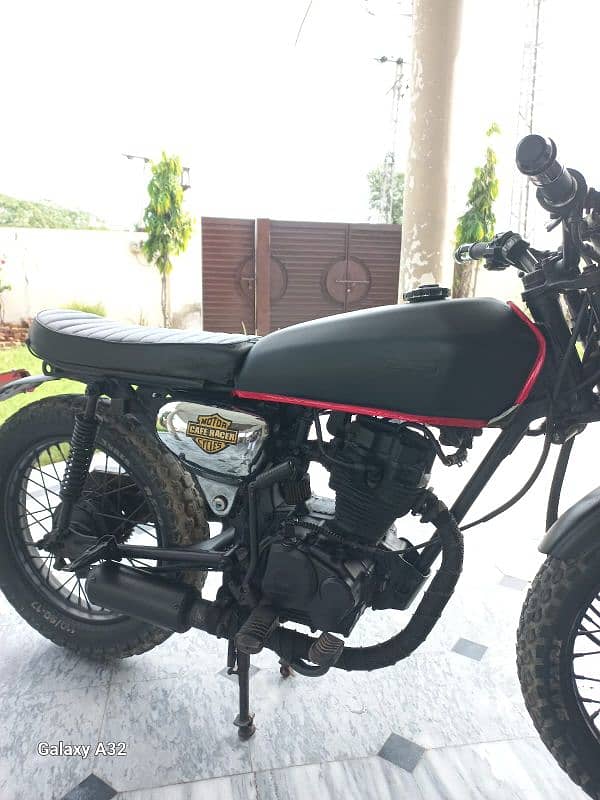 cafe racer 125 cc with exhaust fat tires installed 4