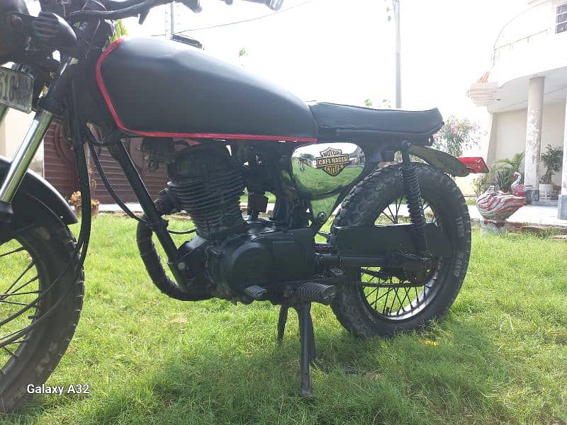 cafe racer 125 cc with exhaust fat tires installed 6