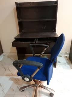 Stydy table with book shelves along steel chair