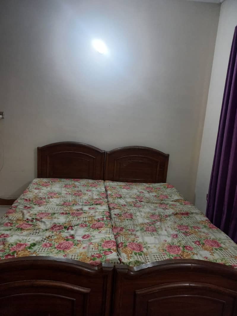 2 wooden single beds with 2 single mattress 1