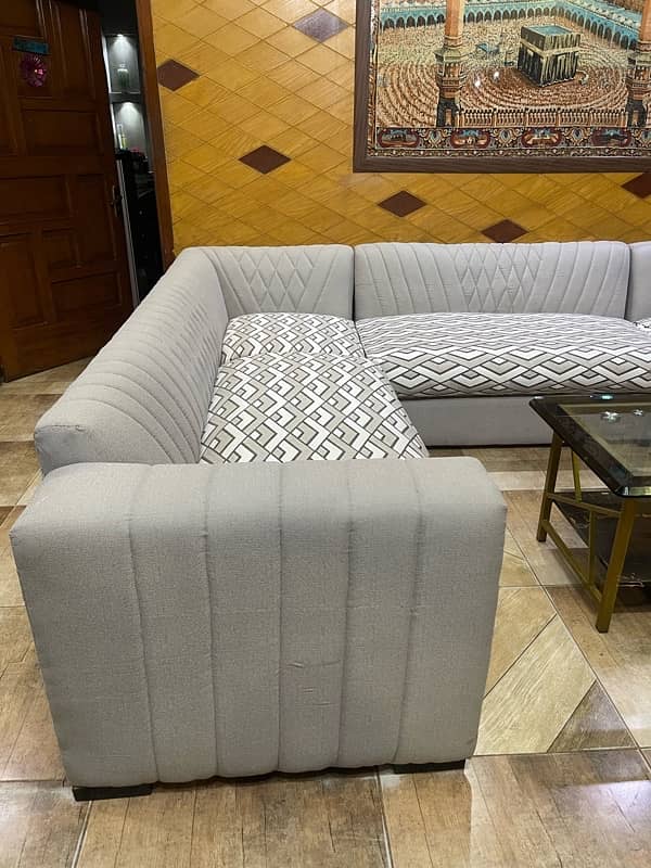 L shaped 8 seater sofa with center table 1