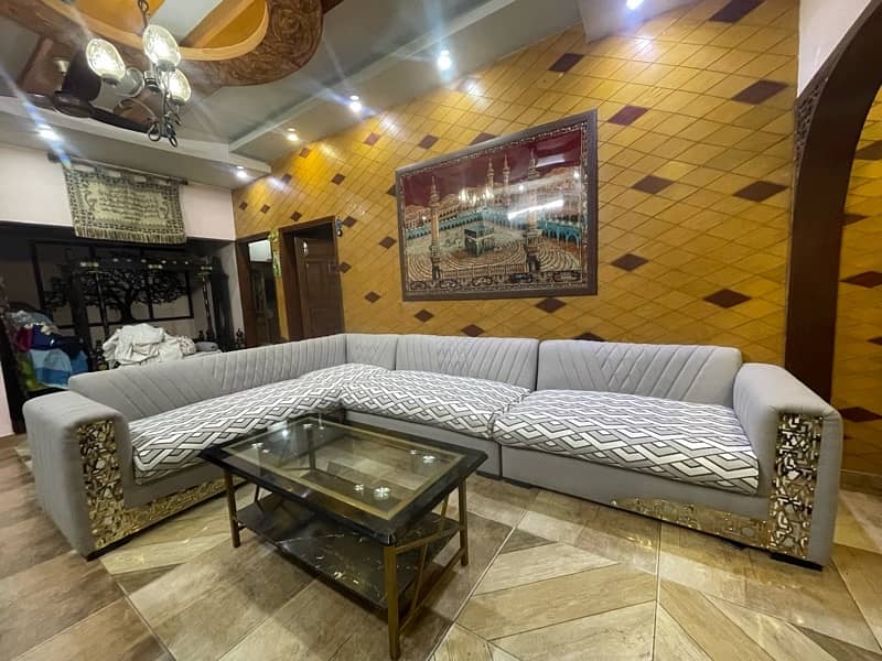 L shaped 8 seater sofa with center table 7