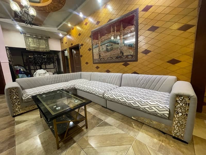 L shaped 8 seater sofa with center table 9