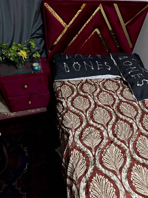 Maroon single bed with side table 1