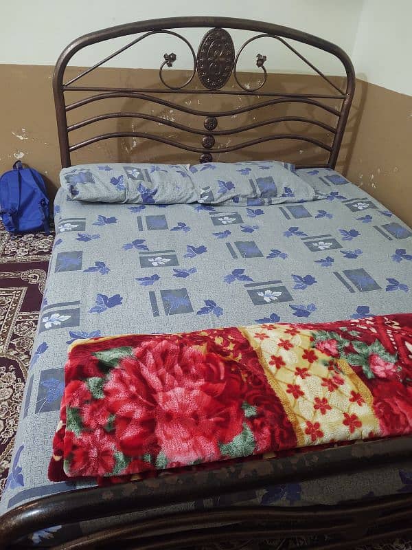 Iron bed Queen size, and 2 mattress foam good condition 0