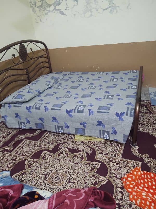 Iron bed Queen size, and 2 mattress foam good condition 1