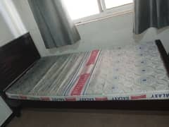 wooden single bed